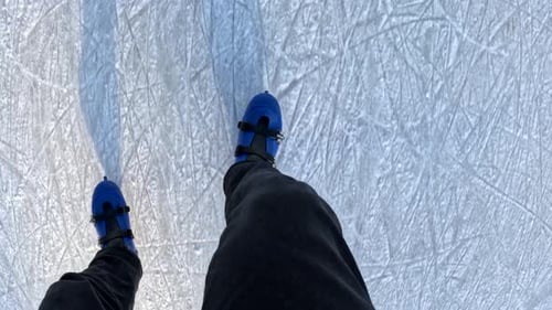 Skating POV on Rink With Blue Ice Skates