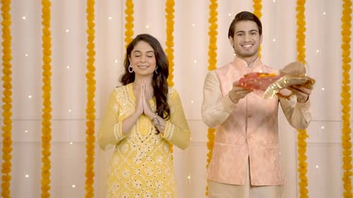 Young Adults Celebrating Traditional Indian Celebration