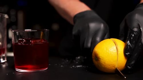 the bartender prepares a cocktail at the bar