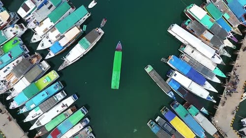 Aerial view above a lot of fishing boats, at the Labuan Bajo harbor, island of Flores in the Nusa Te
