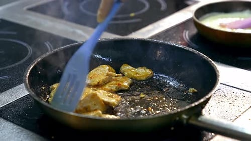 Close up of frying in pan.