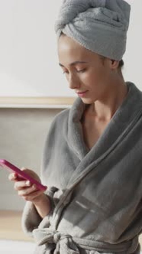 Close Up of Pretty Woman Typing on Smartphone While Cooking Breakfast Beautiful Caucasian Female