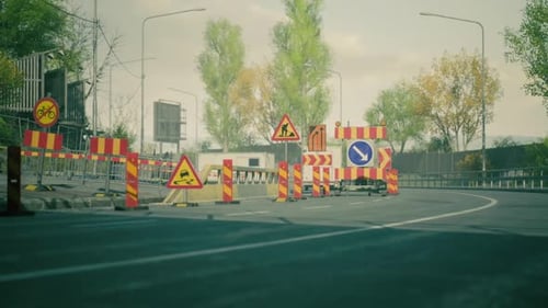 Road Construction with Warning Signs and Barriers in an Urban Setting