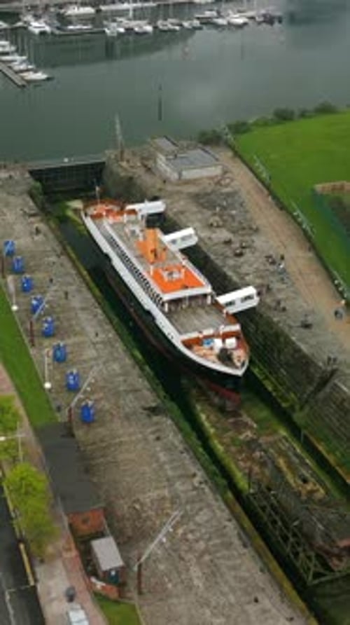 Ship in Urban Port Docked in Waterway