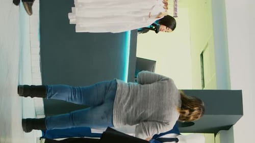 Woman Browsing Clothes in Modern Fashion Store