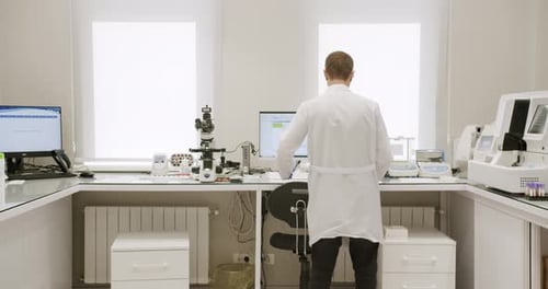 Scientist Working in Modern Laboratory Setting