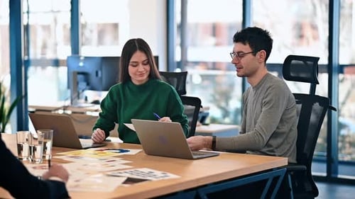 Team Working Together in Modern Office Space