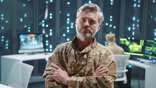 Military Army Portrait Mature Caucasian Soldier in Camouflage Crossing Arms Posing at Server Racks