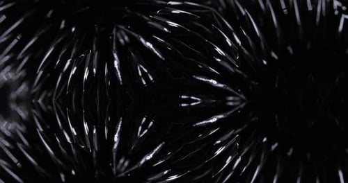 Abstract Dark Liquid Metal Morphing Kaleidoscope Pattern