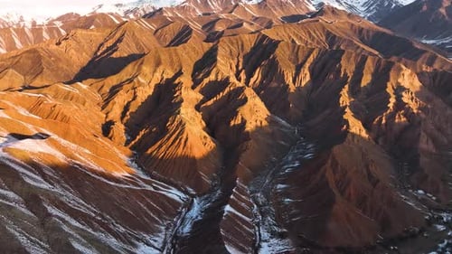 Abstract mountain patterns with snow and sunlight