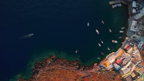 Aerial Harbor View of Cliffside Coastal Village at Golden Hour