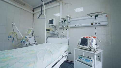 New hospital bed and equipment in a clean room. Empty intensive care room