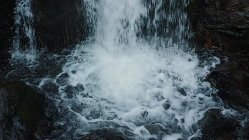 Huge water stream with clear water falling down. Waterfall of mountain river