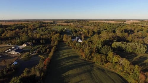 Aerial View of Farmhouse in Autumn Landscape