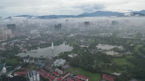Morning awakening of Tasik Titiwangsa as low clouds hover above.
