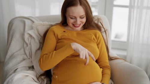 Pregnant Woman Playing with Her Tummy Health Pregnancy Motherhood Procreation Concept Happiness Girl