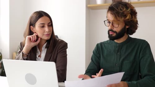 Colleagues Collaborating in Modern Office