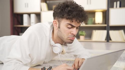 Young man using laptop.