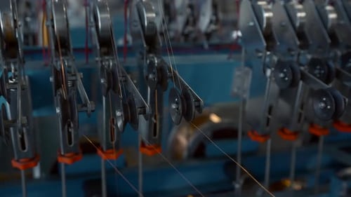 Close Up of Many Small Steel Wire Coils at the Factory Creative Industrial Background with Thin