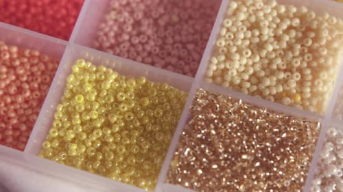 Box of beads in different colors