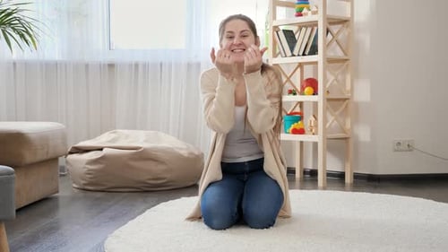 Brunette Woman Gestures on White Carpet At Home