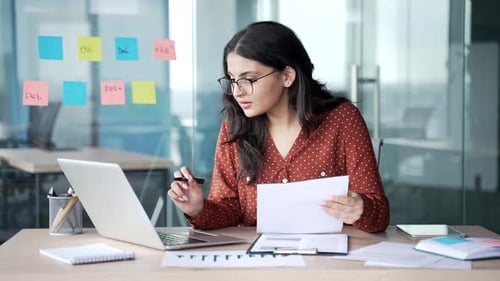 Woman working with laptop happy with good results
