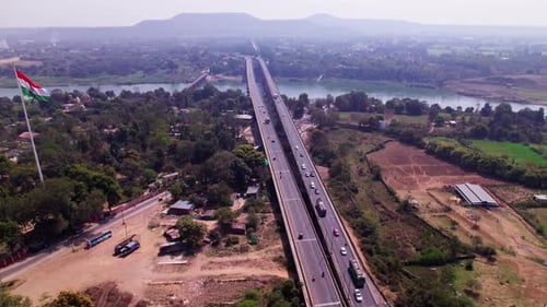 Tilwara bridge with crop fields lands and national flag at jotpur, jabalpur, madhya pradesh, india.