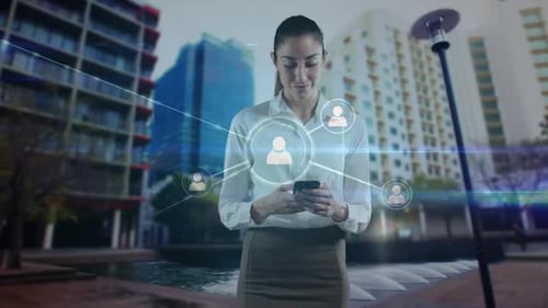 Animation of network of connections over businesswoman using smartphone in city