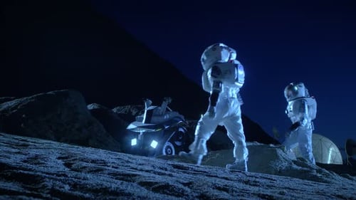 Astronauts Working with a Rover on a Moon