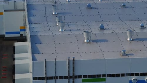 Roof of Production Plant with Metal Chimneys Upper View