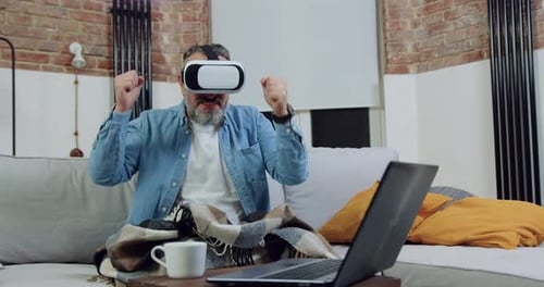 Adult Using VR Headset Reacting at Home