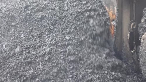 Asphalt Paver at Work Close Up in the City Asphalt