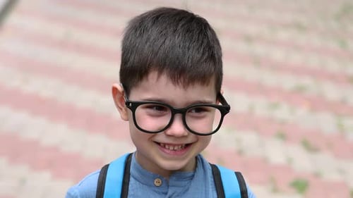 preschooler boy going to school, first day.happy smiling kid with backpack