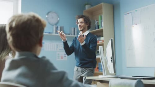 Teacher Giving a Lesson to Children in Classroom