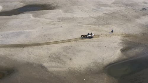 Aerial view of horse cart on the sand, Bangladesh.