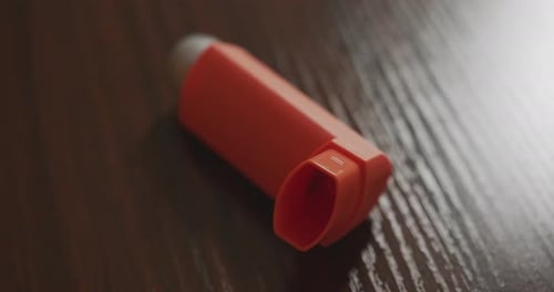 Close Up of an Asthma Inhaler on a Table