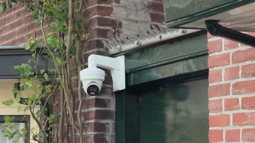 Outdoor Security Surveillance Camera on Brick Building