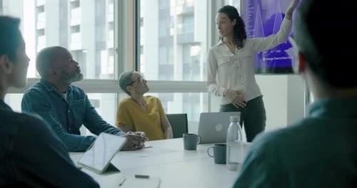 Business People Applauding Female Manager Success during Meeting in Office