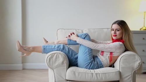 Stylish Woman Relaxing Comfortably in Armchair