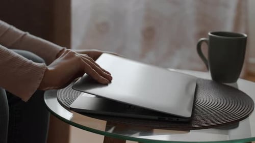 Adult Woman Opens Laptop and Begins Typing