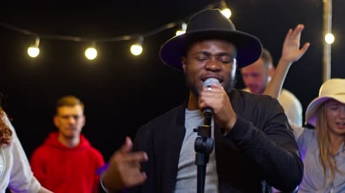 Band Performing Live Music At Nighttime Party