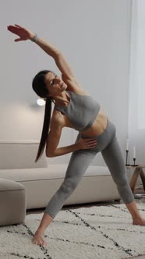 Woman Stretching and Exercising in Her Living Room