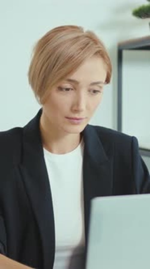 Woman Working on Computer in Clean Office
