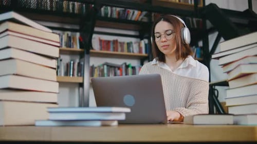 Young Girl College Student Sit at Desk Use Pc Laptop Computer Watching Distance Online Learning