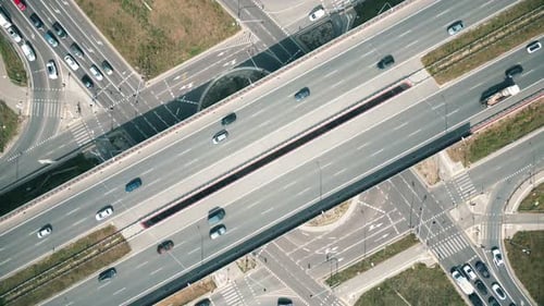 Aerial view of cars driving on round intersection in city, Transportation roundabout infrastructure,