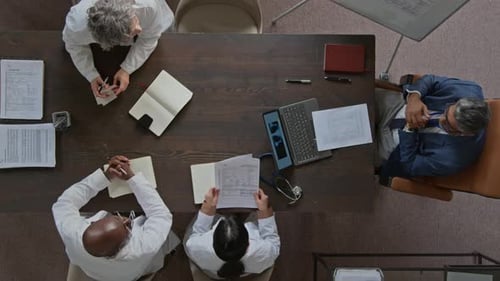 Top View of Hospital Executive Conducting Meeting with Doctors