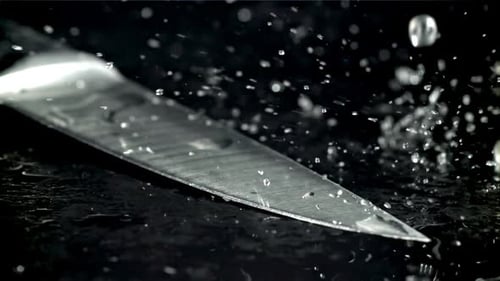 Drops of Water Fall on the Knife Filmed on a Highspeed Camera at 1000 Fps
