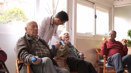 Seniors Exercising with Weights in Bright Room