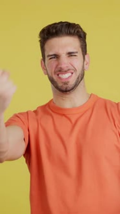 Man Celebrating Success With Clenched Fists And Cheers