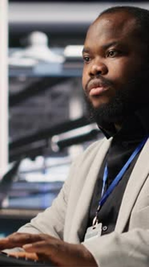 Vertical Video Data Center Computer Scientist Monitoring Servers Performing AI Training